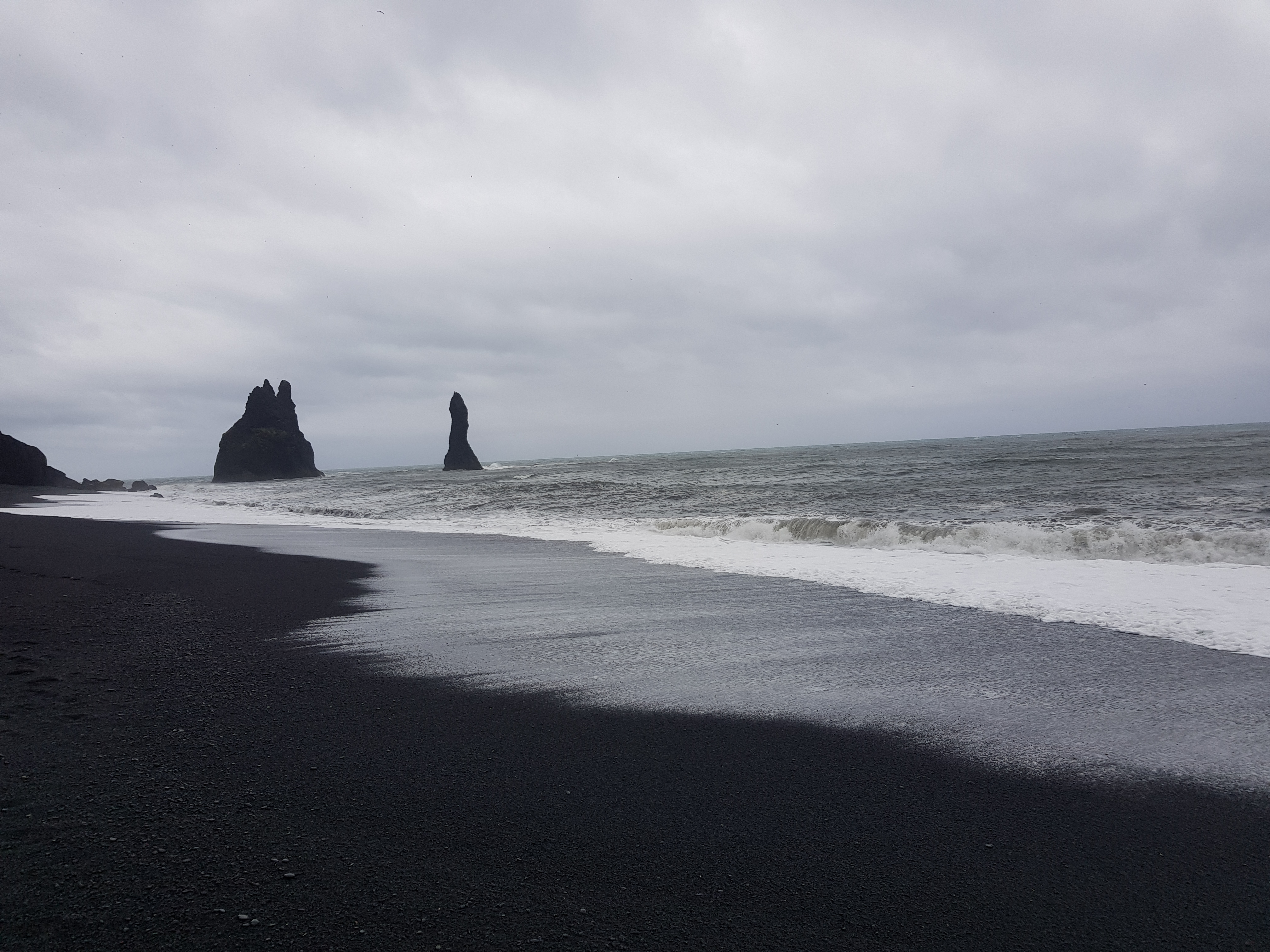 Reynisfjara beach, Iceland - world-famous black-sand beach found on the South Coast of Iceland